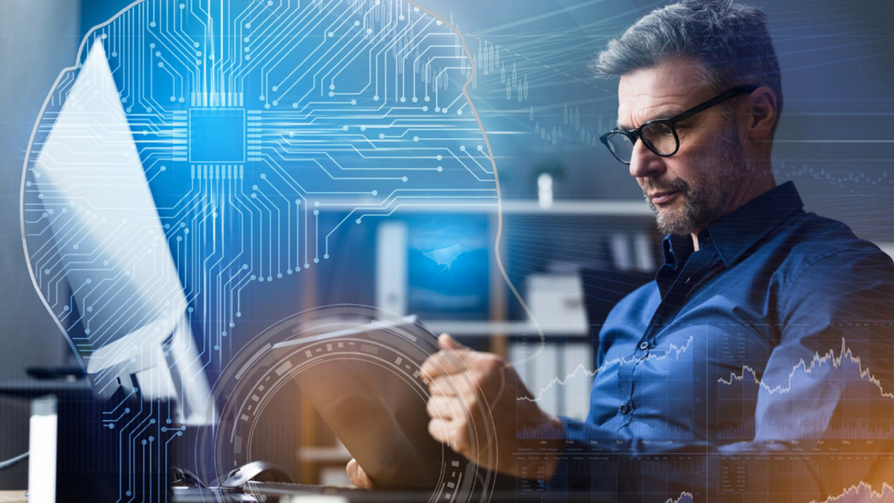 Image depicting a business man using AI on a laptop..