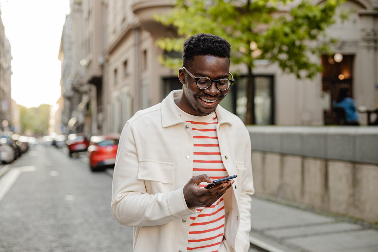 A man looks at his phone.