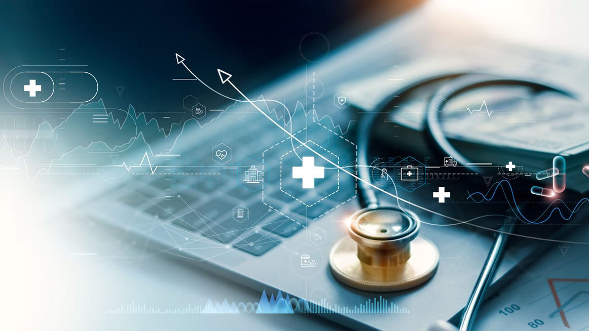 A laptop with a stethoscope on it.