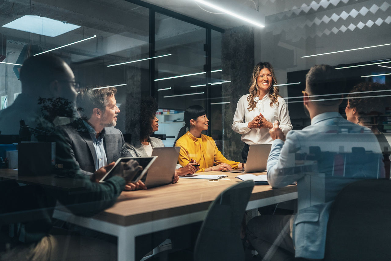 Group of business persons in business meeting. Group of entrepreneurs on meeting in board room. Corporate business team on meeting in the office having discussion. Senior managers sharing ideas for new strategy