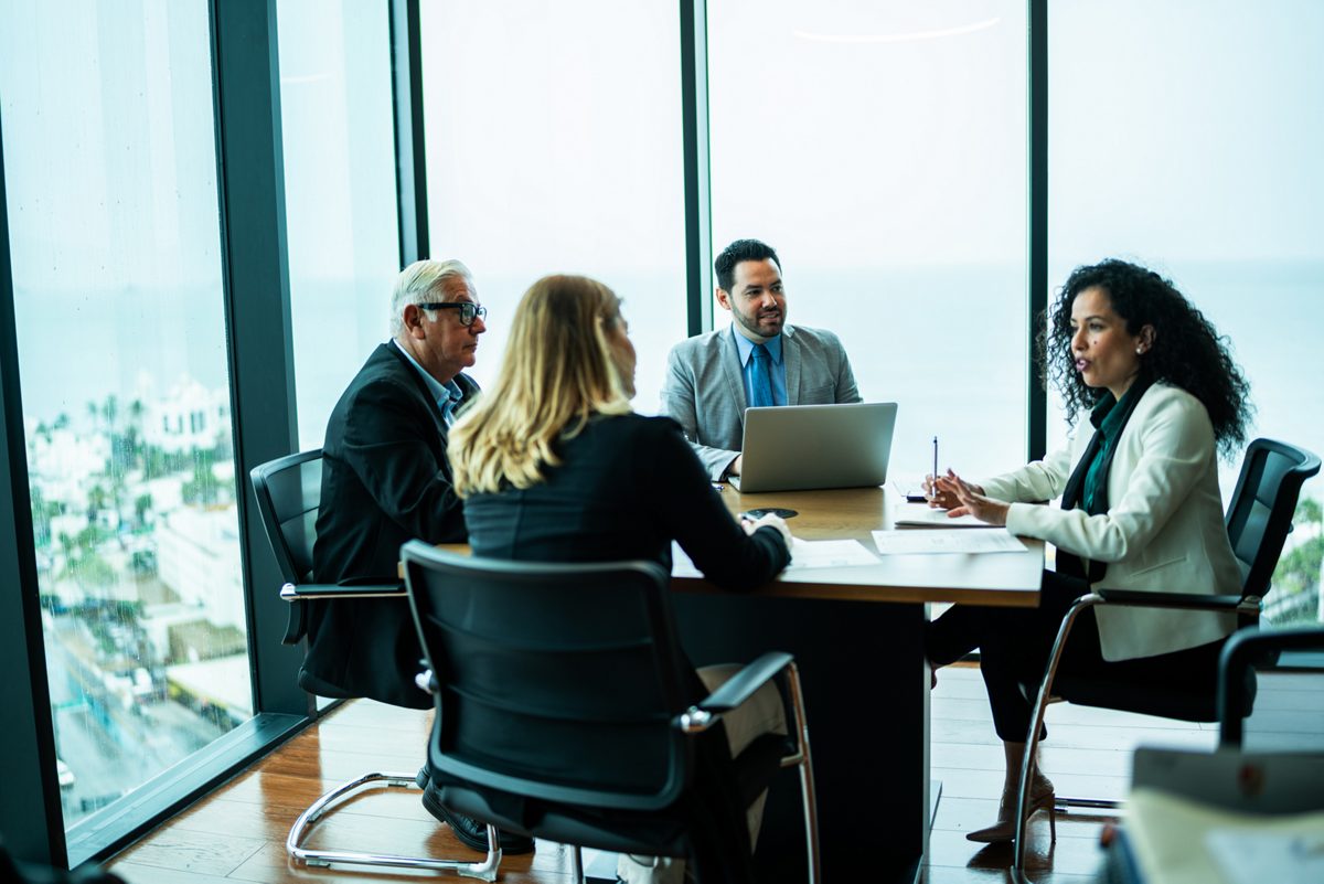 Coworkers talking on business meeting on office