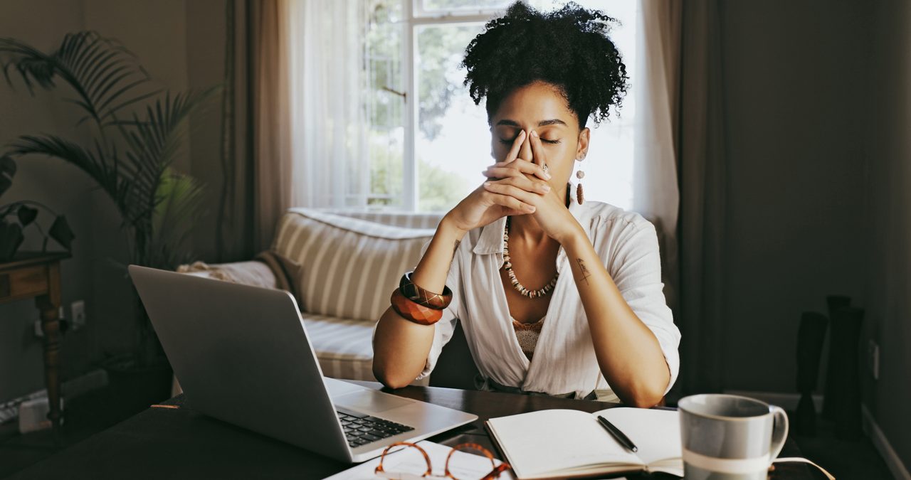 Stress, headache and work from home woman planning, writing and creative research for mental health problem. Laptop, digital person and writer fatigue, burnout or frustrated for online startup budget