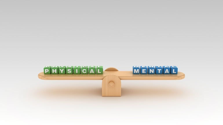 A seesaw with the words physical and mental on it.