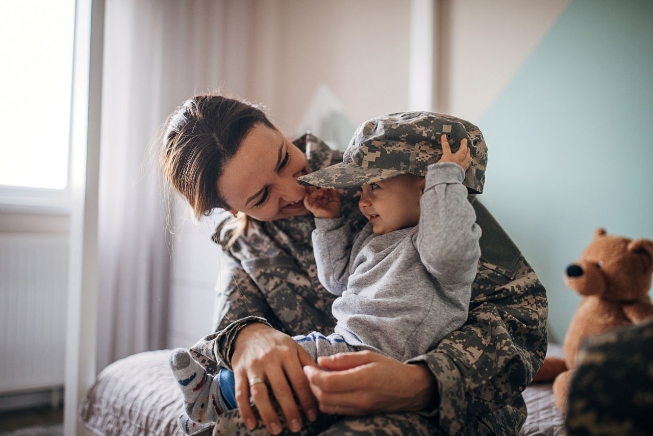 One young woman, soldier, returns from military service and meeting her baby boy after a long time.