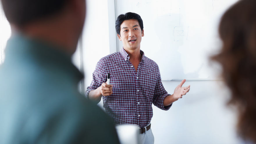 Business people discussing upcoming work in a meeting.