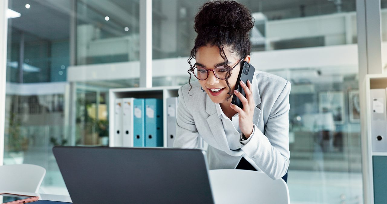 Phone call, laptop and happy corporate woman, advocate or attorney smile for online results, proposal or settlement deal. Conversation, mobile cellphone and lawyer consulting on legal project report