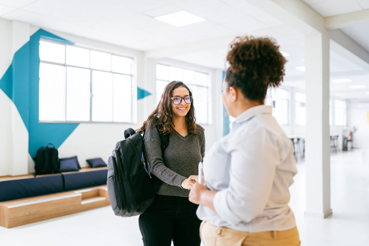 A manager greets her new employee.