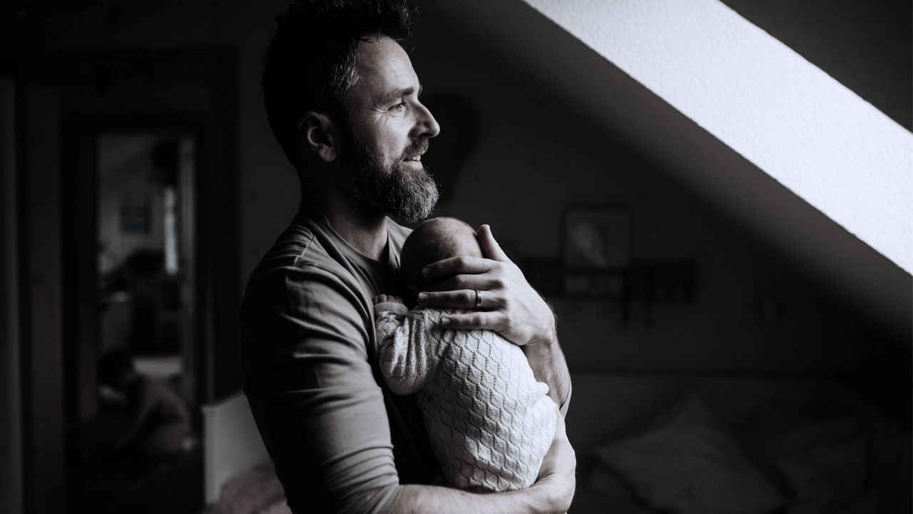 Man holding baby