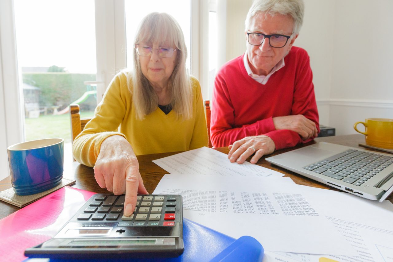 older couple calculating finances