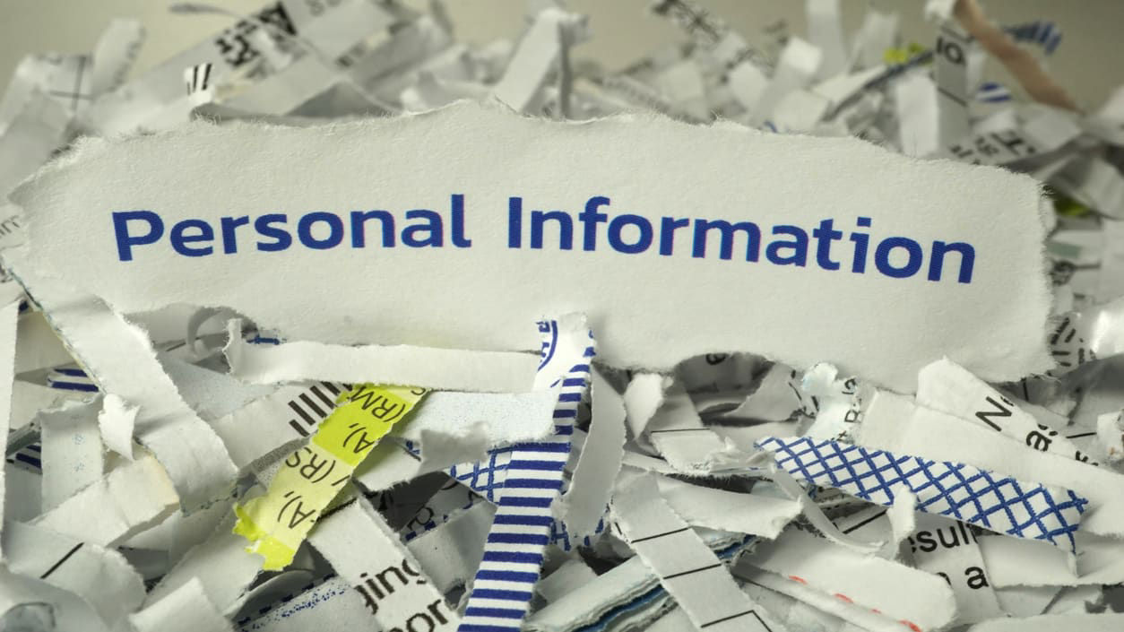 Shredded paper with the word personal information on it.