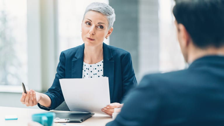 executive speaking with a colleague