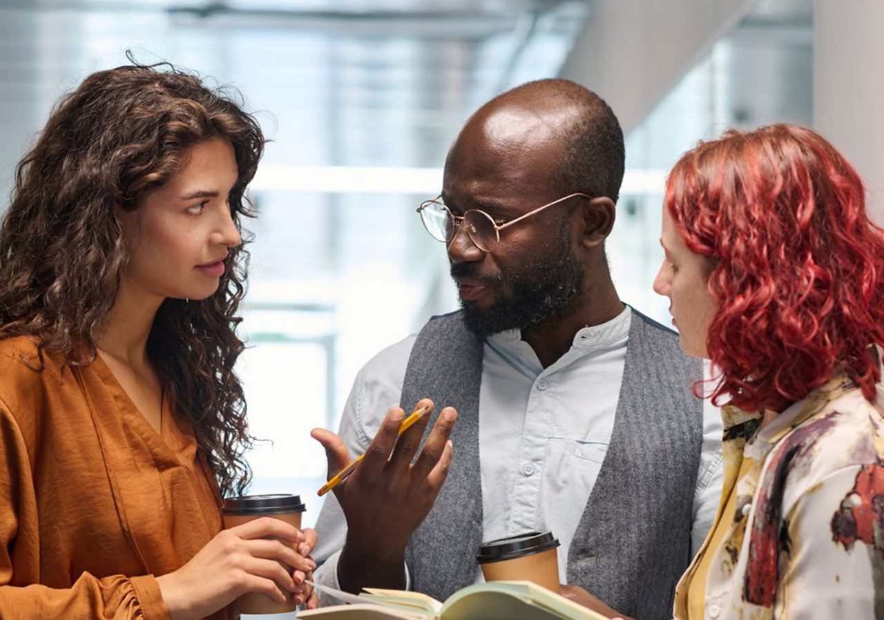 Three professional workers having a serious conversation.