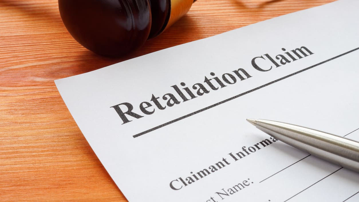 A retaliation claim is sitting on top of a judge's gavel.