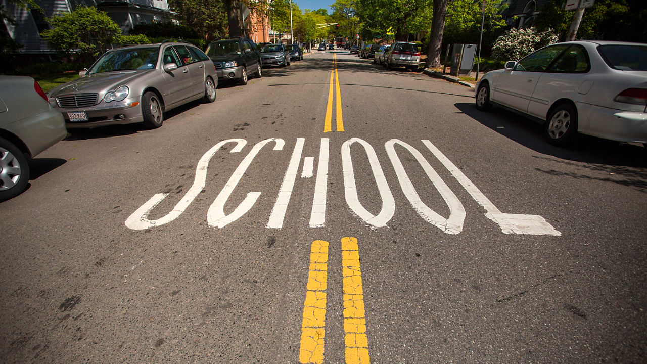 A street with the word school painted on it.