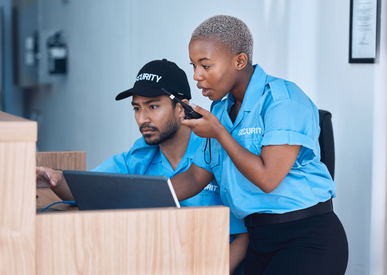 Security guards at a desk in an office building