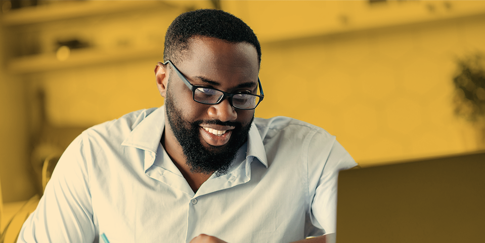 seminars-duotones-certification-exam-prep-general-topic-2-black-man-at-computer-smiling