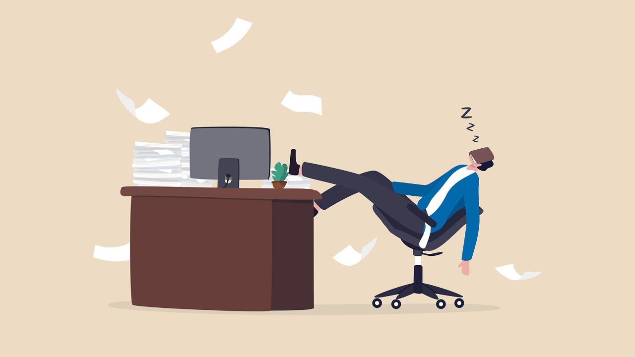 A businessman is sleeping on his chair at his desk.