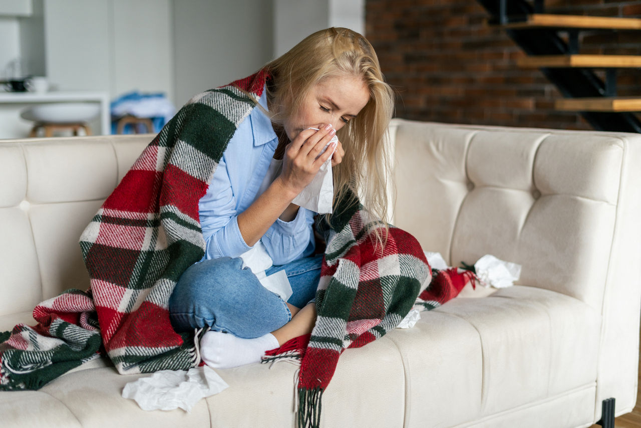 Woman sick on couch