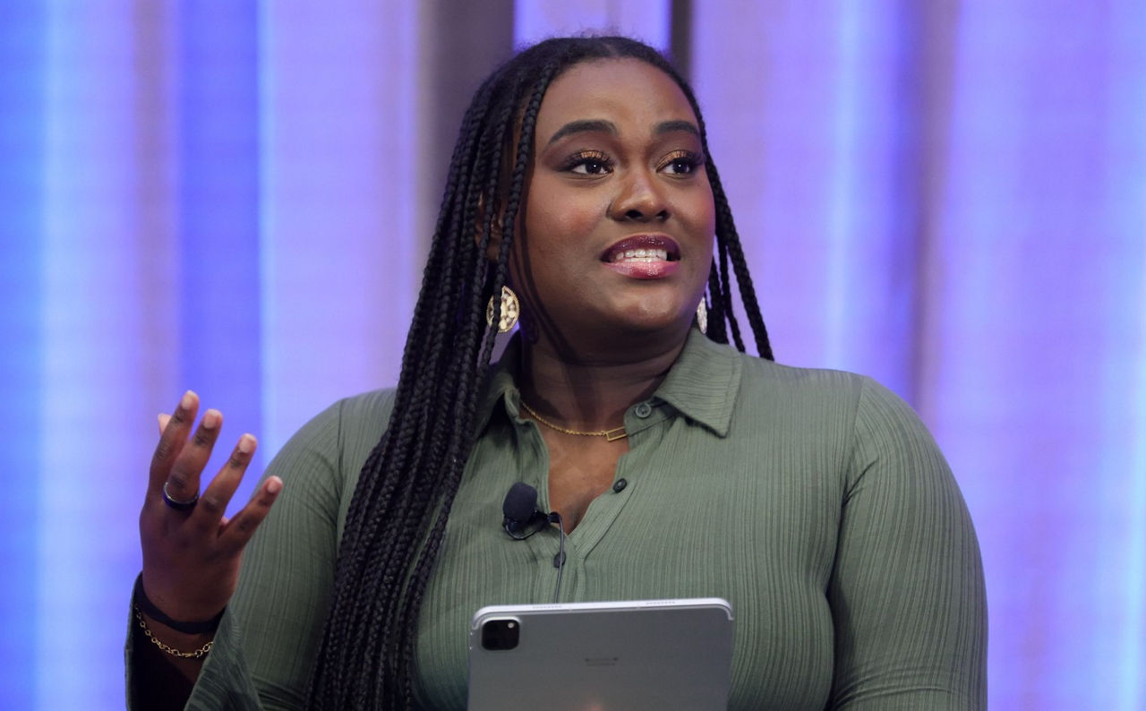 Seychelle Hercules speaking on stage at Talent26