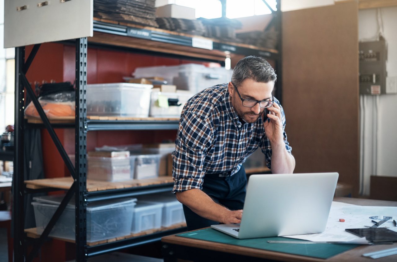 small biz owner working desk