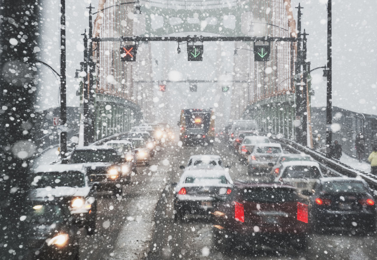 Rush hour traffic during a heavy snowfall.