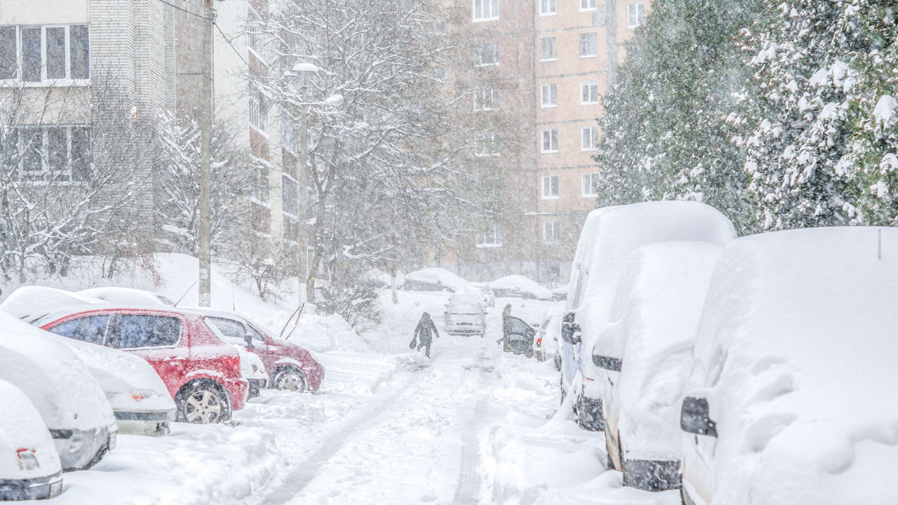 A snowy street during a snowstorm.