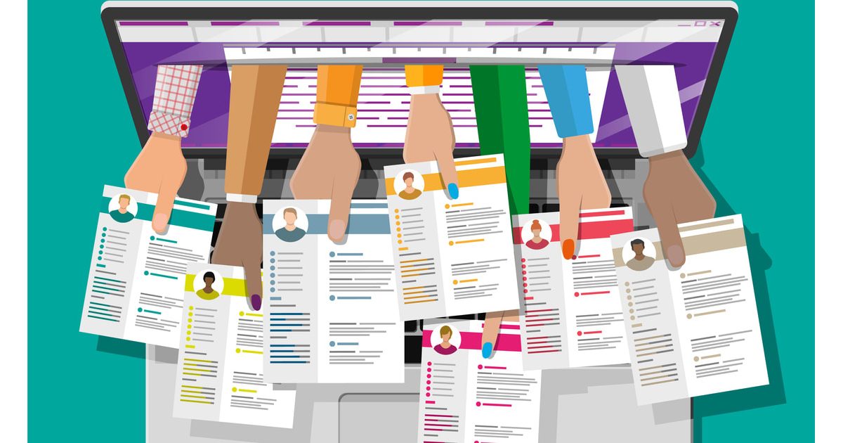 A group of people holding resumes on a laptop.