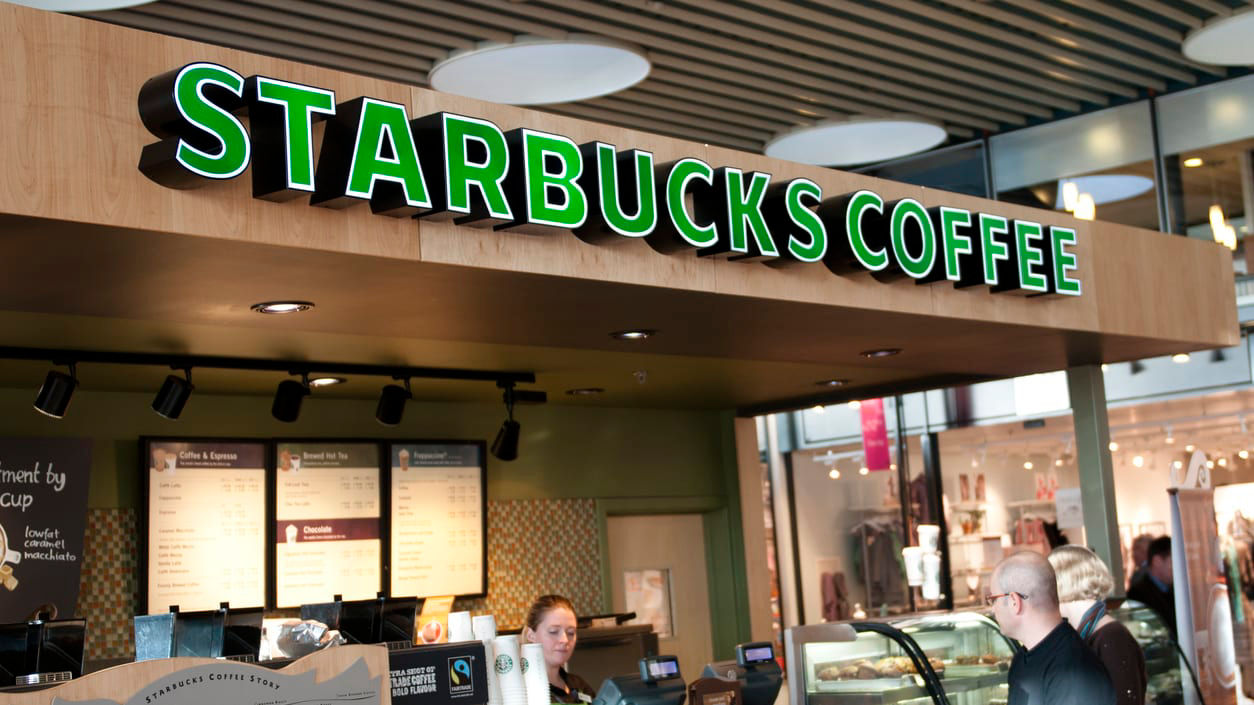 A starbucks coffee shop in a shopping mall.