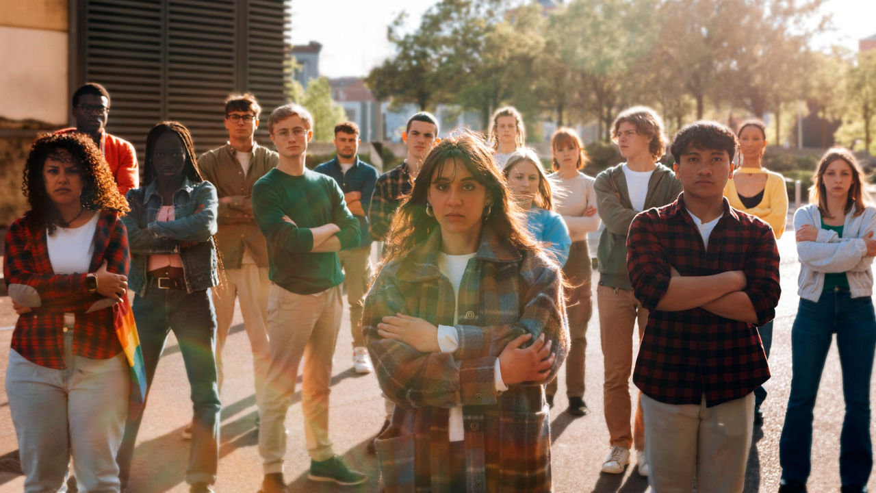 A group of people standing in front of a building.