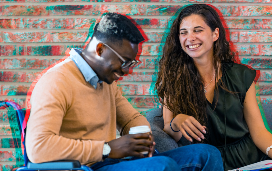 Students laughing with one another.