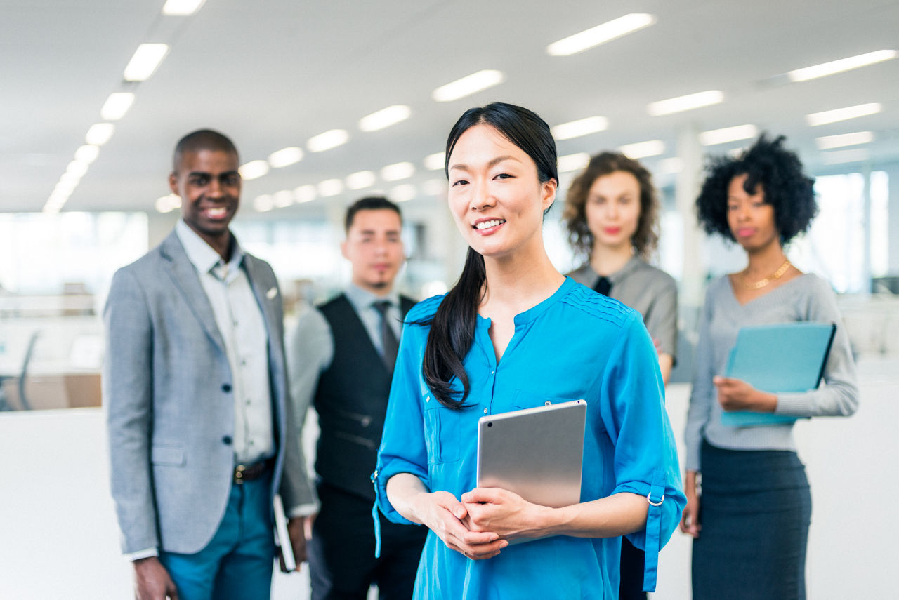 Japanese business woman manager of a multiracial business team