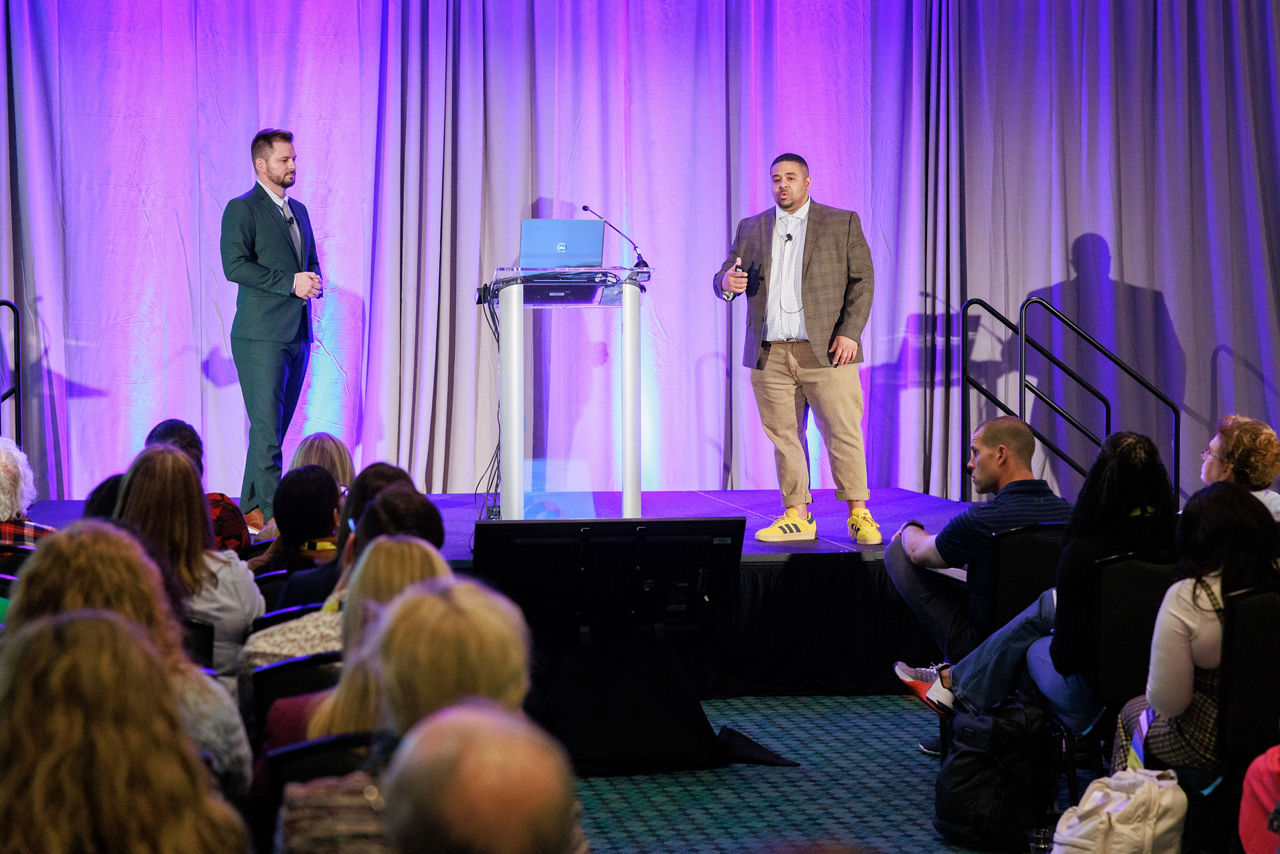Jared Snyder and Noble Potts speaking on stage at SHRM Talent 2025 session.
