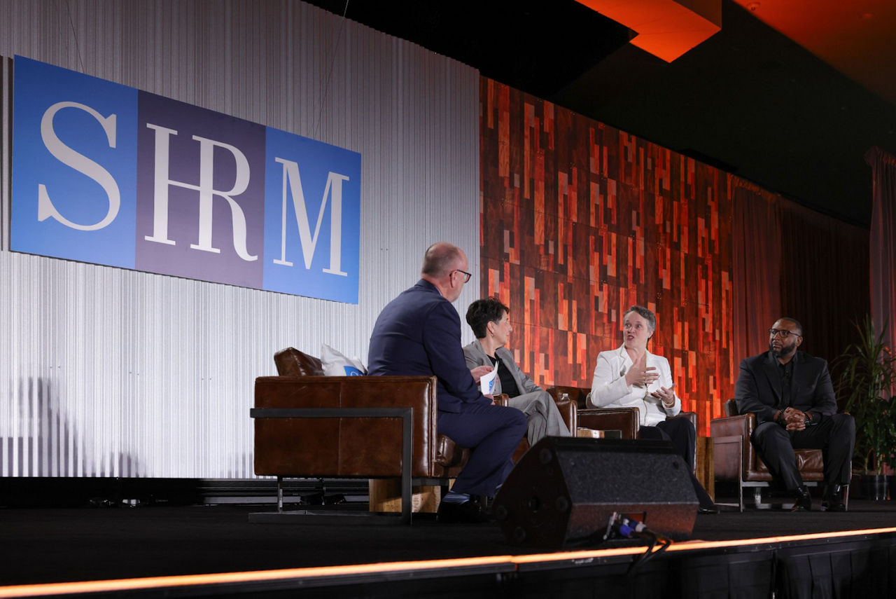 Panelists on SHRM Talent26 conference stage. From left to right: Jim Link, Joy, Mary Beth, and Nsjane