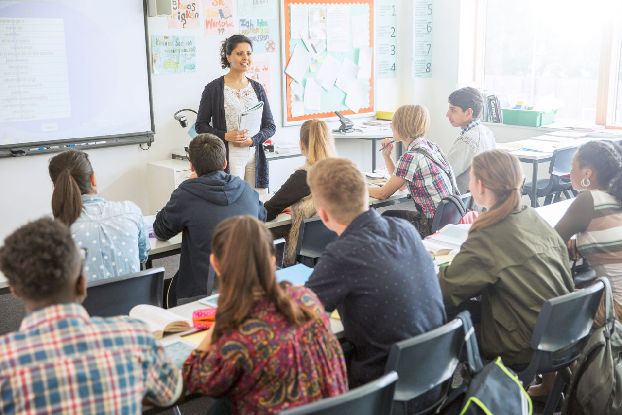 high school teacher with students in class