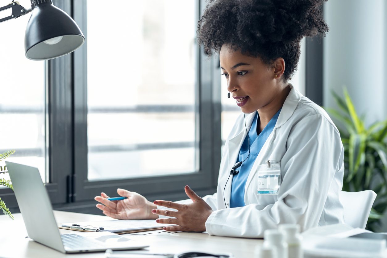 doctor at a laptop conducting virtual care 