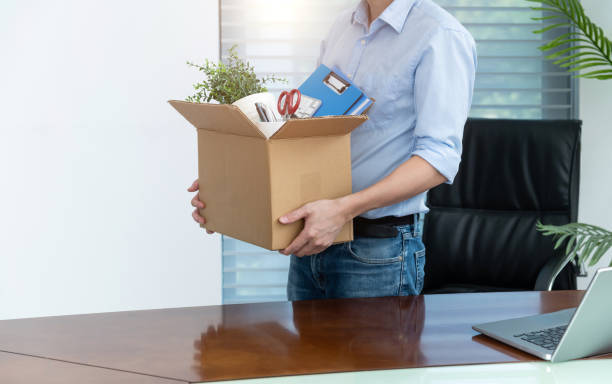 Employee carries personal items in box