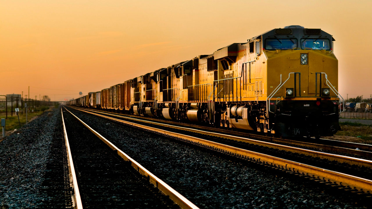 A train is traveling down the tracks.