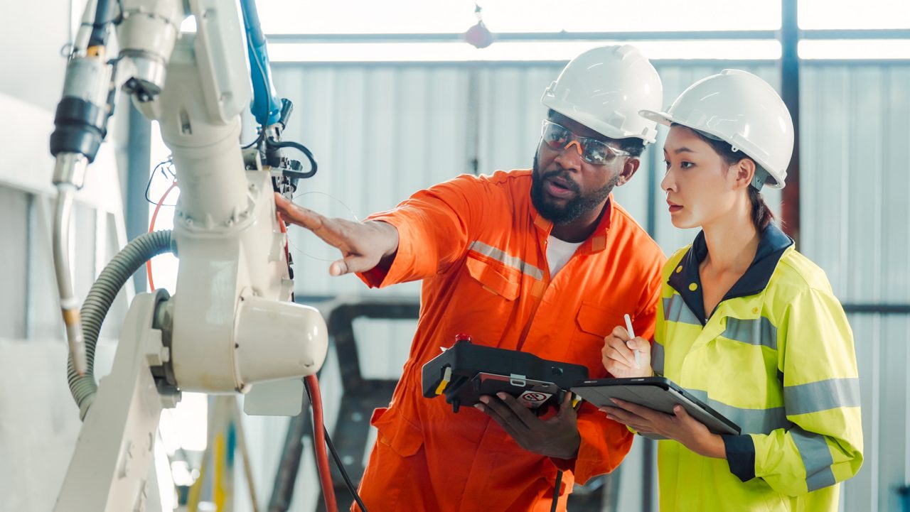 Engineer training and discussing robot development