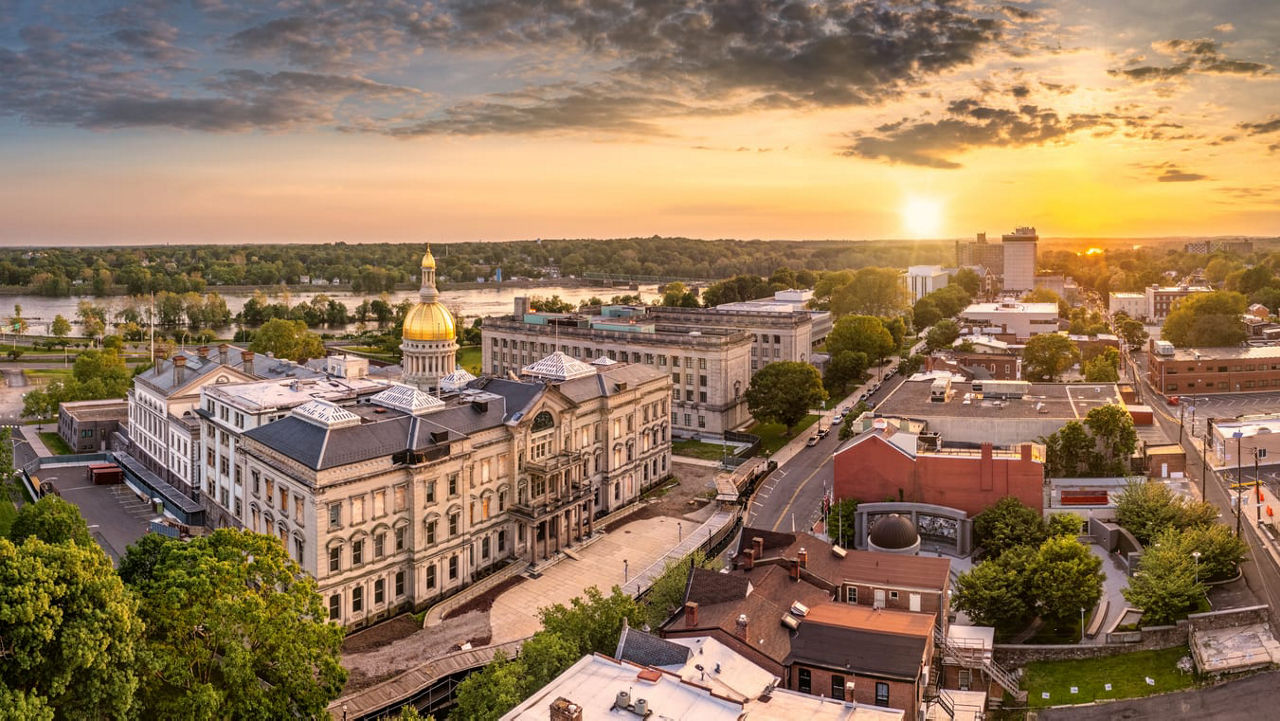 An aerial view of a city at sunset.