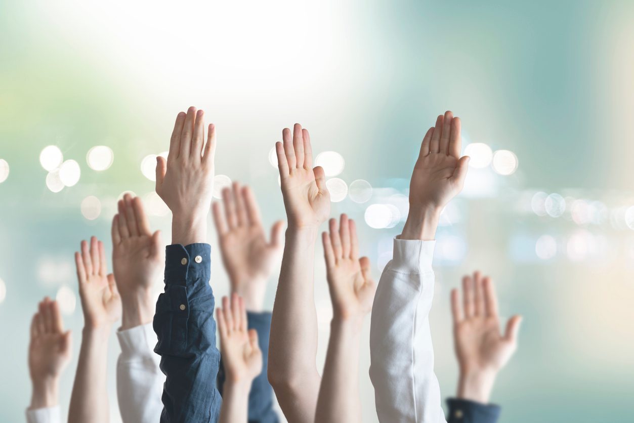 hands raised in vote