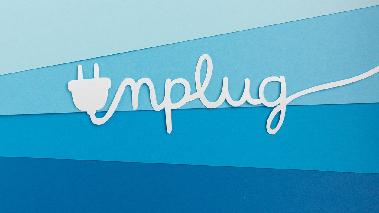 A graphic with the word unplug spelled out with an electrical cord.