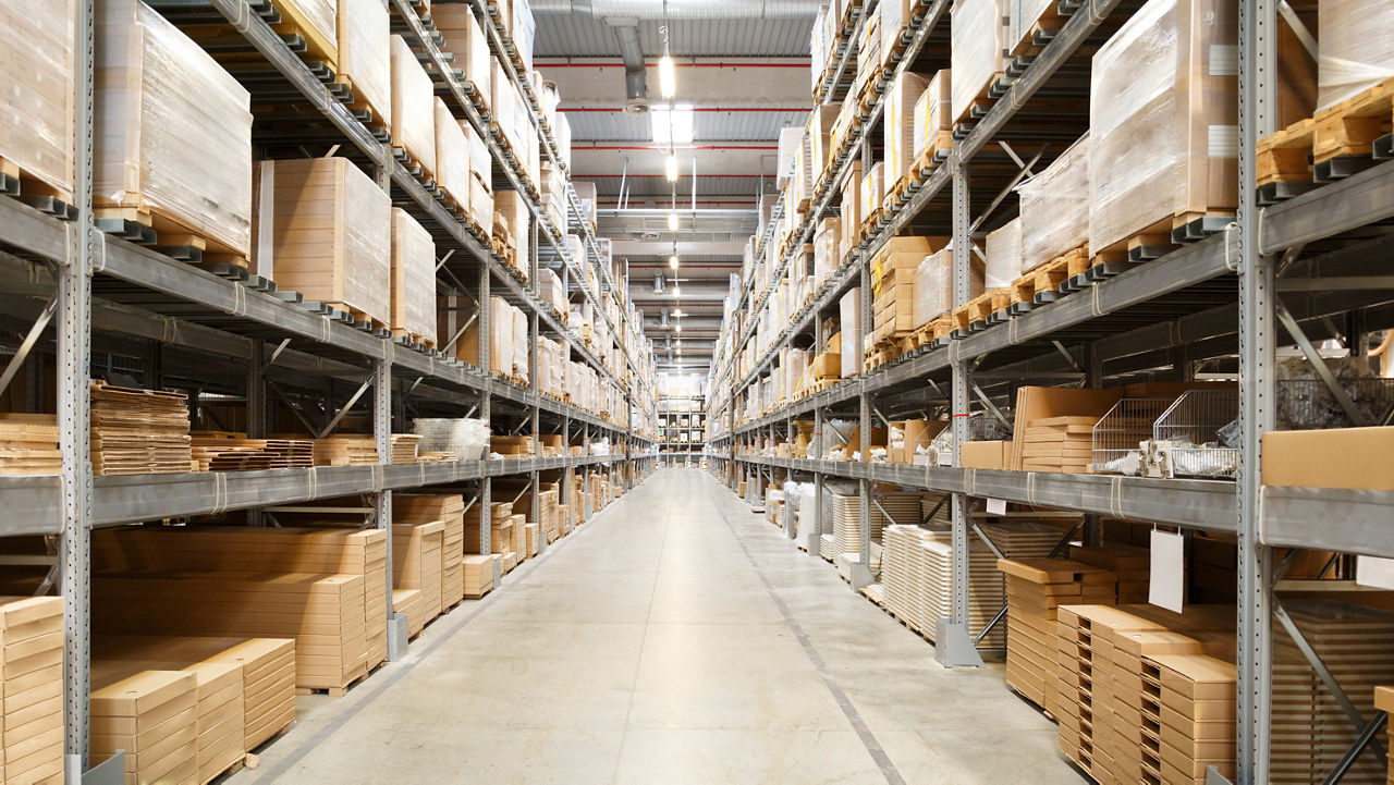 A warehouse filled with boxes and pallets.