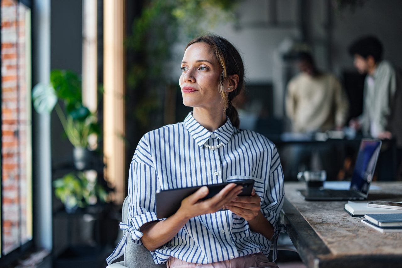 woman in office thinking