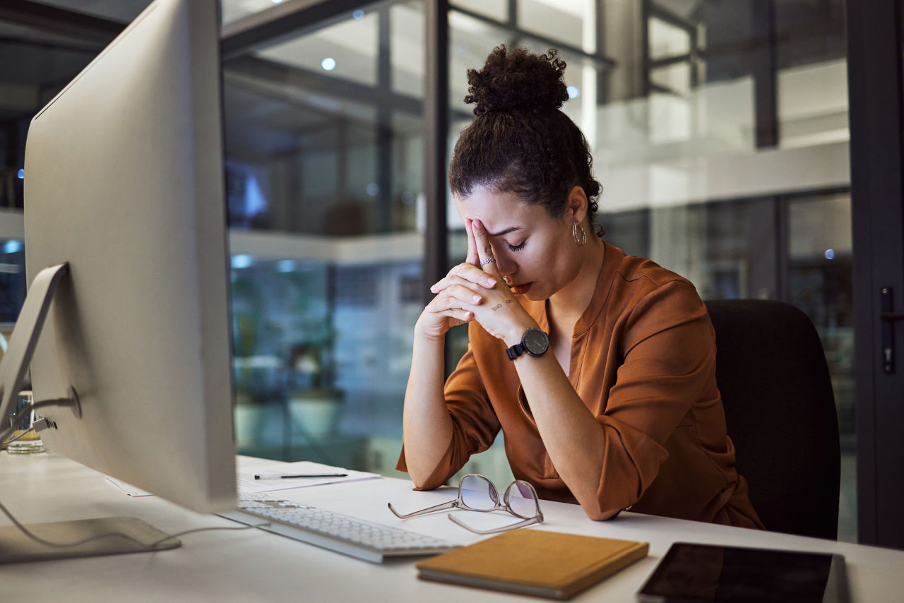 Headache, business woman at night and computer stress while working for a deadline with pc glitch. Sad corporate manager with anxiety about target working at desk screen late to complete task online