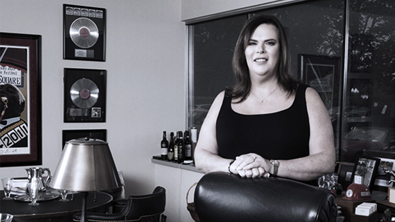 Wynne Nowland standing behind her office desk