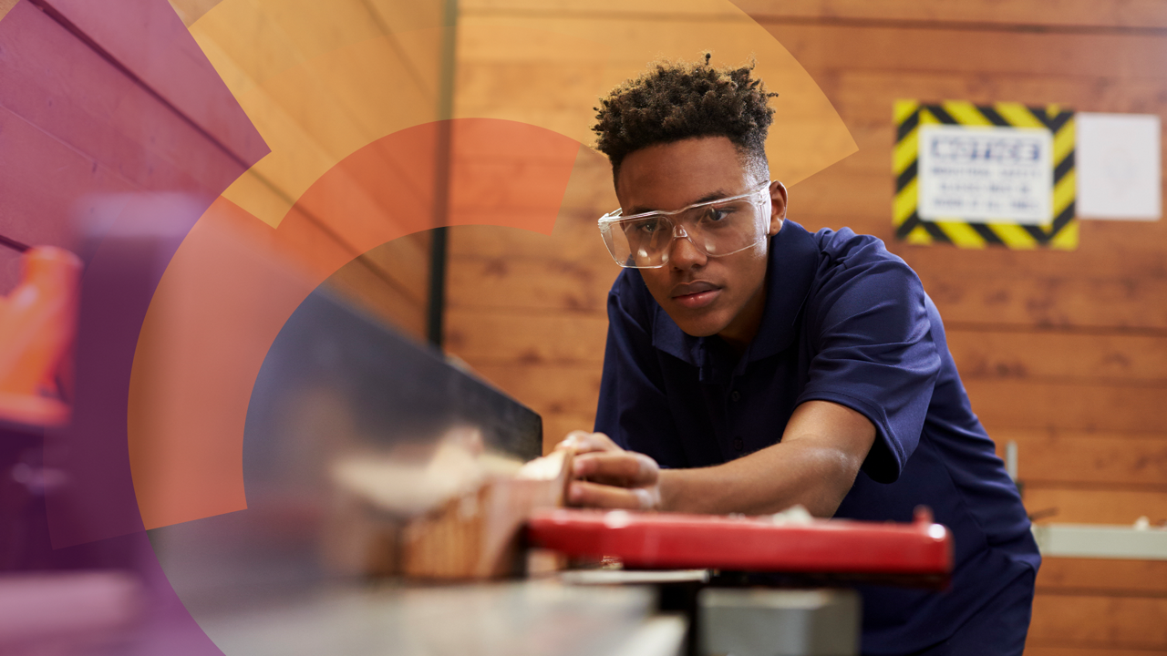 young man using a table saw