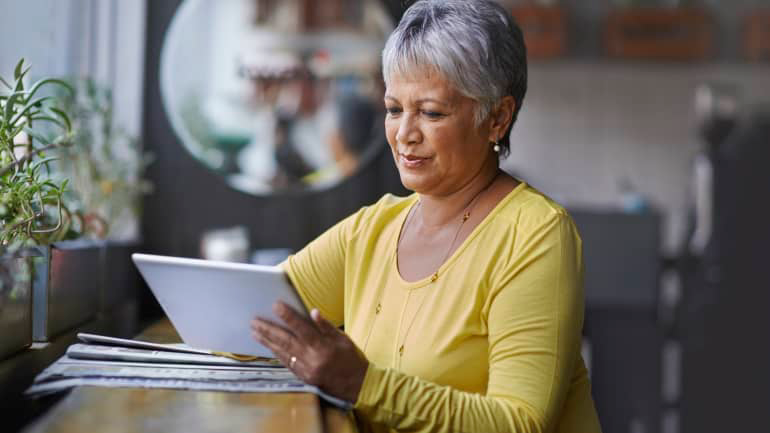 women reading her tablet