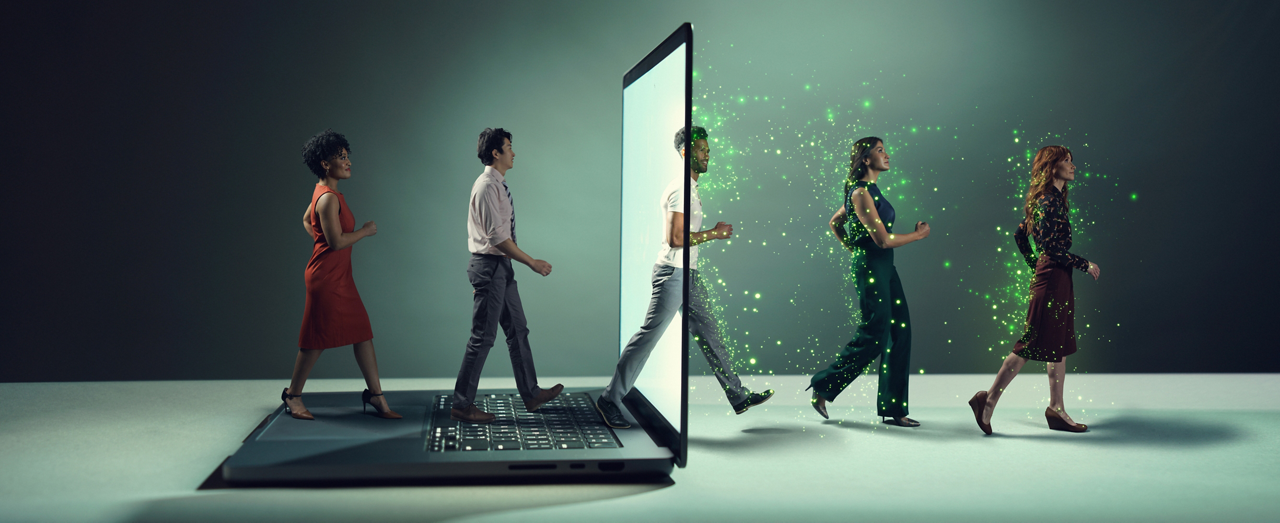 Art depicting a diverse group of workers walking through a computer screen, transformed into AI-empowered workers (represented by a high-tech green glow).