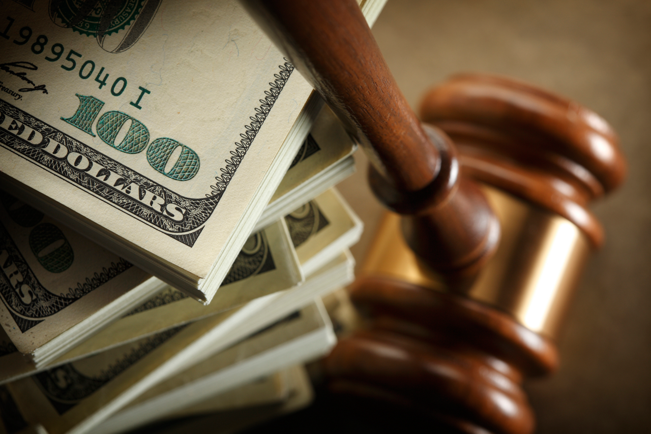 A conceptual look at money and the legal system. Shot with shallow depth of field.