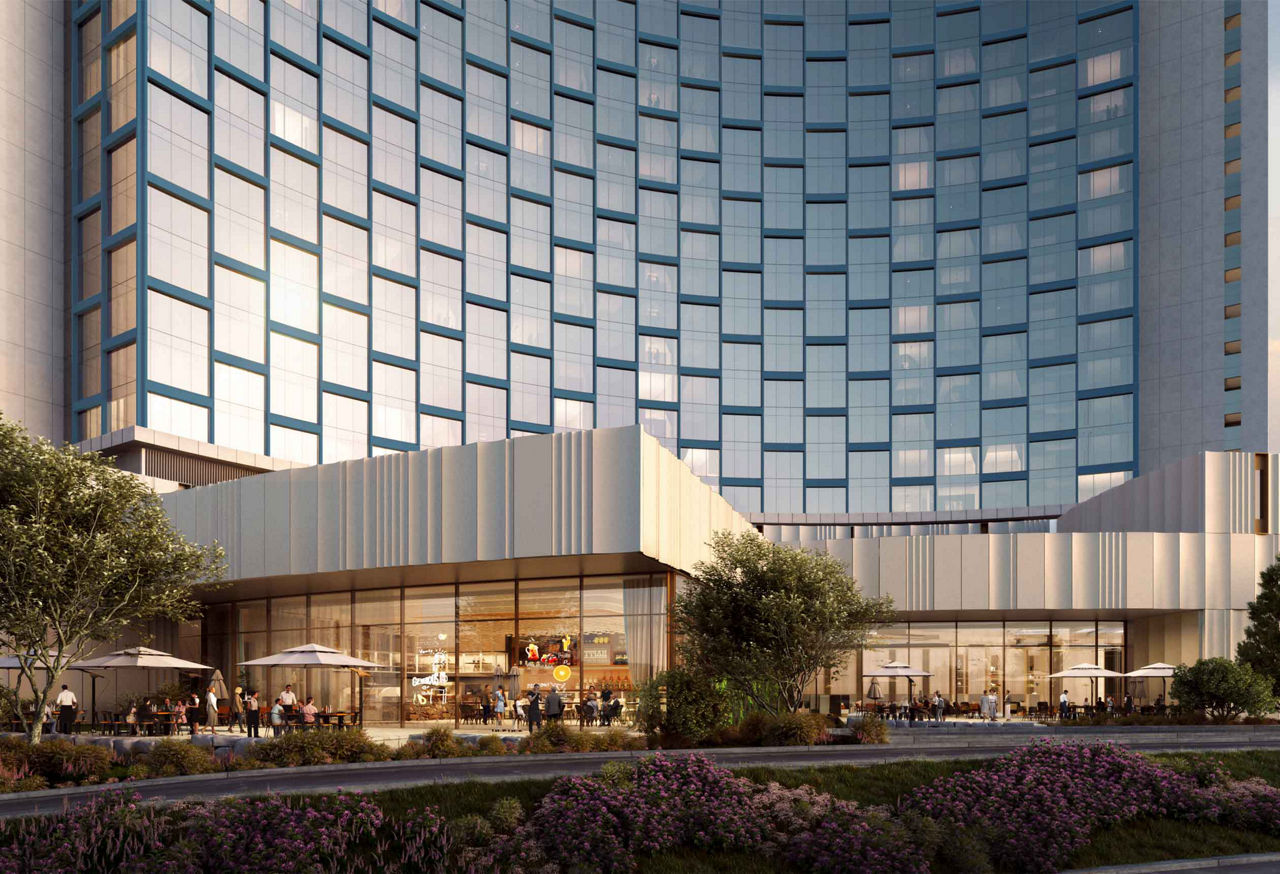 Modern hotel exterior with outdoor terrace dining